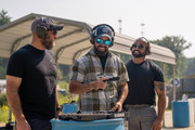 Three shooters at range with handgun
