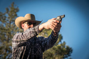 Shooter or hunter testing ammunition with clear ballistic gel